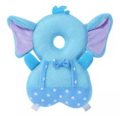 a blue elephant toy with polka dots on it