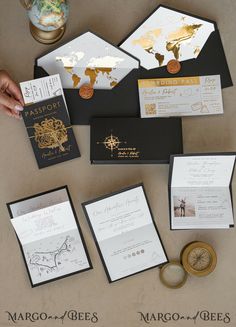 the wedding stationery is laid out on top of each other, including cards and envelopes