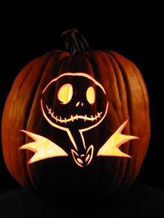 a jack o lantern carved into the shape of a pumpkin with an evil face on it