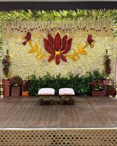 the stage is decorated with flowers and greenery