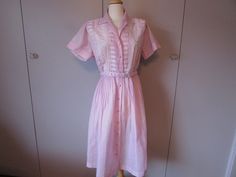 Pictures kind of look like the color pink, but actually the dress is a wonderful lilac color. The shoulder picture will show the right color. Great waist dress with eyelet material on the top and the shoulders are pleated.  Tag says 18 1/2.  Measurements are:  Bust is 42", waist is 36", shoulders are 16" and length is 44".  Comes with a matching belt.  All are in excellent condition. Pink Short Sleeve Dress With Pleated Waist, Pink Pleated Dress For Daywear, The Color Pink, Rock Springs, Vintage Closet, Lilac Color, Eyelet Dress, Waist Dress, Dress Clothes For Women