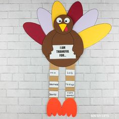 a paper turkey holding a sign that says, i am thanksgiving fun with words on it