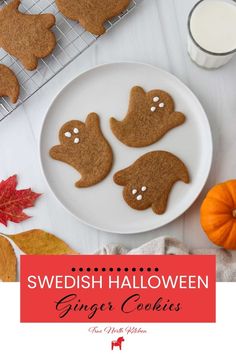 three ginger cookies on a plate with the words swedish halloween ginger cookies in front of them