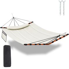 a white hammock with black straps and a bag next to the hammock