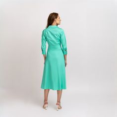 One of our bestsellers, the shirtdress is your everyday choice. Cut from a medium weight fabric with a hint of stretch, with rows of cotton macrame, it has a belt that you can tie in the waist. Side pockets.    Wear yours with flats or trainers by day.   Proudly designed & made in Romania, Europe. Details & Care   Dress color: Green Mint. Fabric : 95% cotton 5% elastane. It is recommended to wash at 30 degrees and iron inside out. Iron on reverse. To extend the life of the product, it is recommended to store it in a place away from daylight. Button fastenings through front. Elegant Cotton Dresses With 3/4 Sleeve, Elegant Fitted Shirt Dress With 3/4 Sleeve, Fitted Collared Cotton Midi Dress, Fitted Cotton Dress With Collared Neckline, Cotton Workwear Dress With 3/4 Sleeve, Green Cotton Midi Length Shirt Dress, Green Cotton Midi Shirt Dress, Fitted Cotton Midi Shirt Dress, Fitted 3/4 Sleeve Shirt Dress For Daywear