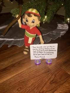 a christmas ornament with a elf on it next to a sign that says, you've made this one for me