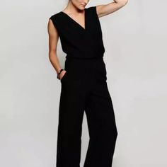 Black Jumpsuit With Deep V-Neck, Elastic Waist, Zip Up Back, And Functioning Pockets. Never Worn But Without Tags. Versatile Fitted V-neck Jumpsuits And Rompers, Versatile Fitted V-neck Jumpsuit, Casual V-neck Jumpsuits And Rompers For Work, Chic Black Summer Pantsuit, Black V-neck Jumpsuits And Rompers For Spring, Solid V-neck Pantsuit For Night Out, Casual V-neck Pantsuit For Spring, Casual V-neck Pantsuit For Work, Casual V-neck Spring Pantsuit