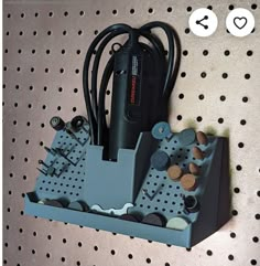 an electronic device is hooked up to a pegboard