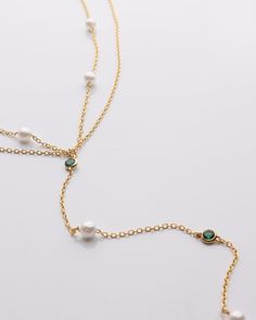 Pearl & Emerald Lariat Necklace Featuring exquisite pearls and vibrant emeralds, this lariat necklace will add elegance and sophistication to any outfit. DETAILS: 14k Gold Vermeil Synthetic pearl and emerald stones Double layered 15" with a 2" extender Lobster clasp Resort Jewelry, Backpack Gift, Beauty Clothes, Emerald Stone, Fine Jewellery Earrings, Lariat Necklace, Outfit Details, Ring Bracelet, Earring Necklace