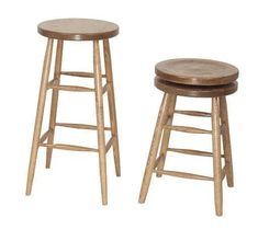 two wooden stools sitting next to each other