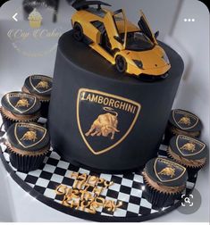 a black cake with yellow cupcakes and a lamb car on top that says lamborgchinn