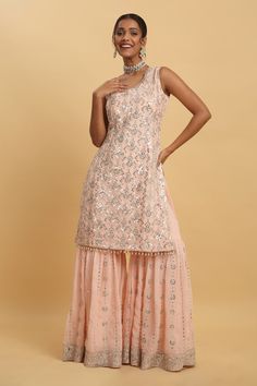 Pink kurta featuring silver zardozi embroidered floral vine motifs, embellished by sequins. Comes with embellished sharara and dupatta. - Aza Fashions Silver Designer Wear Sharara For Eid, Silver Anarkali Sharara Unstitched, Designer Silver Sharara For Eid, Silver Sharara With Zari Work For Eid, Silver Kurta With Mirror Work For Wedding, Silver Sharara For Designer Wear And Eid, Festive Silver Set With Gota Work, Silver Sharara For Diwali Designer Wear, Silver Designer Sharara For Diwali