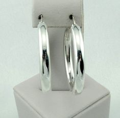 "Lovely vintage minimalist style sterling silver latch back circle hoop earrings. Marked 925. A great addition to your jewelry collection. FREE SHIPPING! Details: Sterling Silver: (as shown in photo) Approximate Earring Dimensions: (from open side) 1/2 inch across with a 5/8 inch gap at top x 1 5/8 inch tall x 3/16 inch wide. Total Weight (together): 8.0 grams FREE domestic shipping by USPS Priority Mail delivery confirmation and includes insurance. If the item is to be shipped internationally E Sterling Silver Minimalist Hoop Earrings With Shiny Finish, Sterling Silver Huggie Earrings With Shiny Finish, Minimalist White Gold Hoop Earrings With Sterling Silver Clasp, Modern Sterling Silver Round Hoop Earrings, Sterling Silver Hoop Earrings With Shiny Finish, Everyday Sterling Silver Hoop Earrings With Shiny Finish, Minimalist Round Hoop Earrings With Shiny Finish, Anniversary Sterling Silver Hoop Earrings With Shiny Finish, Everyday White Gold Hoop Earrings With Sterling Silver Clasp