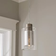 a clear glass light hanging from a ceiling