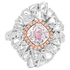 18kt white gold ring with diamonds Gold colour & karat: White gold 18kt Weight: 6.79 grams Set with- Stone type: Diamonds Shape: Cushion Carat: 1.01 Colour: Light Pink Clarity: VS2 Surrounding Stones: Diamonds 1) White Diamonds Carat weight: 0.367 ct (45 pcs) Color: F Clarity: VS1/VS2 Cut: Round 2) Side Pink Diamonds Carat weight: 0.063 ct (24 pcs) Color: Pink Clarity: VS1/VS2 Cut: Round 3) Side Rose Cut Pear Shape Diamonds Carat weight: 0.939 ct (24 pcs) Color: F Clarity: VS1/VS2 Cut: Rose Cut Pear Shape Report type and Number: 7363727437 Gia Certified Luxury Cluster Rings, Luxury Cluster Cut Diamond Ring, Luxury Cluster Diamond Ring, Luxury Gia Certified Cluster Rings, Luxury Cluster-cut Diamond Ring, Gia Certified Dazzling Cluster Diamond Ring, Gia Certified Diamond Ring In Fine Jewelry Style, Luxury Gia Certified Diamond White Diamond Ring, Luxury White Platinum Diamond Ring