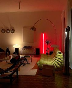 a living room filled with furniture and a red light