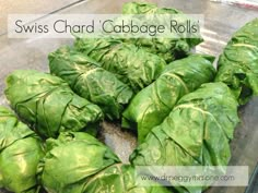 swiss chard cabbage rolls in a glass dish with the words swiss chard cabbage rolls