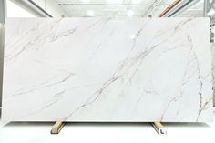 a large white marble slab in a warehouse