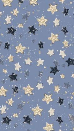 a blue background with gold stars and glitter on the bottom half of each star,