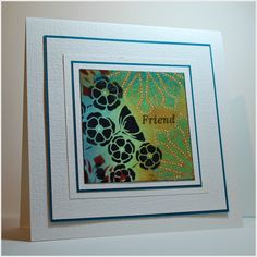 a card with the word friend written on it and flowers in blue, green and yellow