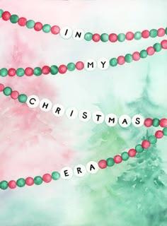 a watercolor christmas card with the words in my christmas era on it and beads