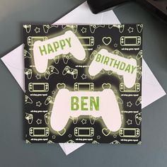 a birthday card with two video game controllers on it