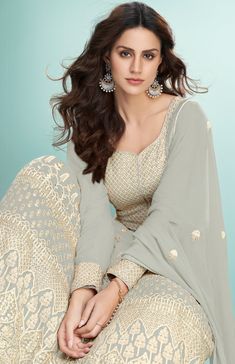 COLOR : Dusty Gray FABRIC : Top - Pure Georgette, Bottom & Inner - Santoon, Dupatta - Pure Georgette WORK : Heavy Resham Embroidery, Zari, Heavy Sequin Work, Motifs, Lace BorderOCCASION : Party Wear, Festival READY-TO-WEAR : NoSTITCHING : Available as semi-stitched fabric, can be stitched using standard size option (+$20). Note: There might be a slight color variation due to lighting and flash used during photoshoot. The bright shade seen is the best closer view of fabric's color. Green Anarkali Suits, Grey Anarkali, Party Wear Anarkali, Anarkali Tops, Georgette Anarkali Suits, Green Anarkali, Indian Anarkali, Resham Embroidery, Georgette Anarkali