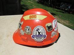 Vintage Hard Hat, Orange Safety Hat, Safety Hard Hat with Stickers Great, vintage hard hat This seems to be a construction workers' hard hat Great costume or great man cave decor Construction Hat, Great Man, Construction Workers, Cave Decor, South Lake Tahoe, Construction Worker, Man Cave Decor, Lake Tahoe, Man Cave