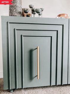 a blue cabinet with gold handles and knobs on the door is shown in this image