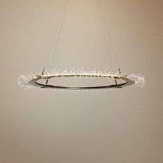 a circular light fixture hanging from the ceiling