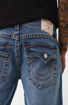 Chunky stitching all over adds signature True Religion style to relaxed-fit, low-stretch straight-leg jeans marked with whiskered details for a lived-in look. 34" inseam; 17" leg opening; 10 3/4" front rise (size 32) Zip fly with button closure Five-pocket style 70% cotton, 28% polyester, 2% elastane Machine wash, line dry Imported Casual Jeans With Seam Detailing And Straight Hem, Casual Bottoms With Contrast Stitching And Straight Hem, Casual Bottoms With Contrast Stitching Straight Hem, Casual Straight Bottoms With Contrast Stitching, Casual Blue Jeans With Seam Detailing, Casual Cropped Jeans With Seam Detailing, Jeans Brands, True Religion, Straight Leg Jeans