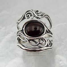 "Stunning NEW band from Hadar \"Nets\" Collection. The ring is made of 925 sterling silver with oval 8mm X 10mm Garnet stone Dimensions: Front Width: 23mm / 0.905 in., Back width: 6mm / 0.236 in. Size: 8 Stamped 925. This beauty will be sent to you in a gift package. All stains, if are any, are due to camera. Please feel free to contact us at any matter. Thank you for looking. Please see my other items in this shop: http://www.etsy.com/shop/jewela To see more designs you are welcome to visit our Silver Garnet Ring Stamped 925, Silver Oval Cabochon Ruby Ring As Gift, Oval Garnet Ring In Silver, Sterling Silver Cabochon Ruby Ring, Silver Garnet Ring, Round Pearl Earrings, Garnet Wedding Rings, Garnet Wedding, Wedding Rings Art