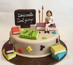 there is a cake that has been decorated to look like a book and school supplies