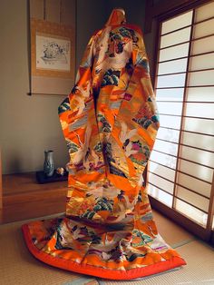 Great condition,  gorgeous orange Uchikake with crane embroidery. The design is based on high-quality silk in shades of orange and gold, adorned with auspicious patterns of cranes and fans, with plum blossoms, pine, and peonies elegantly featured. Sizing information Length: 205 cm (80.71 inches) Length of sleeves: 104 cm (40.94 inches) Length (neck to wrist): 62 cm (24.41 inches) ※Free shipping from Japan with a tracking number. ※Kimono hanger is purchasable only for a buyer of Uchikake from us.  Please send a message if you would like to buy a hanger together with Uchikake. The cost is 25USD for one kimono hanger including shipping cost. We will create a private listing for you to purchase a kimono hanger. ※If your package does not arrive, we will initiate an investigation with the shippi Kimono Wedding Dress, Japanese Wedding Kimono, Crane Embroidery, Wedding Dress Traditional, Japanese Wedding, Plum Blossoms, Wedding Kimono, Kimono Vintage, Dress Traditional