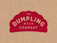 the dumpling company logo is displayed on a piece of brown paper with chinese writing