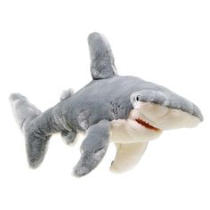 a stuffed shark is in the air with it's mouth open