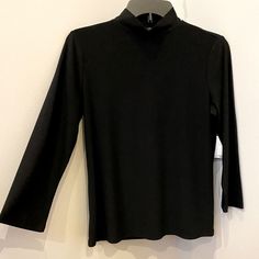 Brand New W/Tag 96% Polyester Turtle Neck Chic Black Mock Neck Top For Spring, Black Mock Neck Top For Fall Layering, Trendy Black Mock Neck Top For Fall, Black Mock Neck Top For Spring Layering, Black Spring Mock Neck Top Trendy Style, Black Mock Neck Top For Winter Layering, Spring Mock Neck Top For Workwear, Trendy Black Mock Neck Top For Spring, Trendy Black Mock Neck Top For Winter