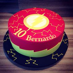 a birthday cake with the name benaro on it and a lightning bolt in the center