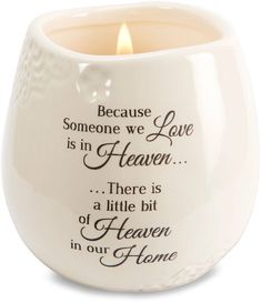 a white ceramic candle holder with a poem on the front and bottom that says because someone we love is in heaven there is a little bit of heaven in our home