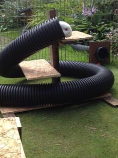 a large black blow dryer sitting on top of a green field