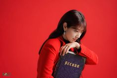 a woman holding a book in her hands