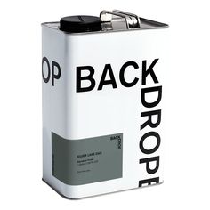 the back drop can is white with black letters on it and has a metal clip