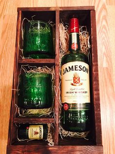 three bottles of jameson in a wooden box