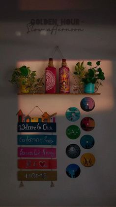 there are many magnets on the wall with plants and bottles above them that says golden hour