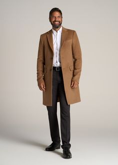 About Our Extra-Long Wool Coat Timeless, stylish and built for your frame. This tall men's coat is essential in every guy's wardrobe, a staple piece that will instantly elevate any outfit while keeping you warm. Every seam has been measured specifically for men between 6'3” and 7'1”, with extra-long sleeves that will cover your tall guy arms and a mid-thigh length that will actually end where it's supposed to. The clean lines of this coat for tall men provide a polished look while the notch lape Masculine Formal Winter Outerwear, Modern Brown Outerwear For Business, Modern Brown Business Outerwear, Modern Brown Outerwear For Business Casual, Business Camel Outerwear With Lapel Collar, Camel Business Outerwear With Lapel Collar, Big And Tall Men Outfits, Coat Guide, Man's Overcoat