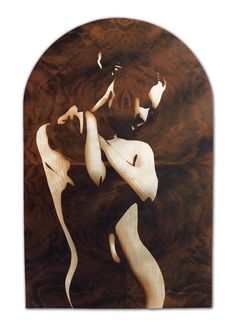 an abstract piece of wood that looks like it has been carved into the shape of a woman's body