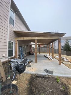 an outdoor covered patio in the process of being built