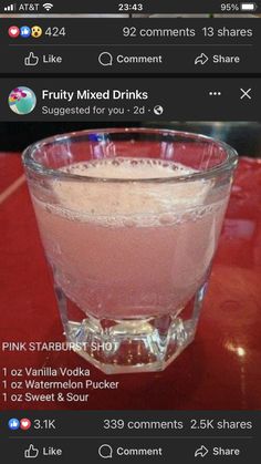 a pink drink sitting on top of a red table