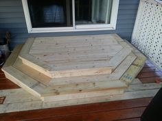 a wooden deck built into the side of a house