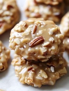 several cookies with pecans and nuts on top